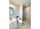 This remodeled bathroom offers a modern, tiled walk-in shower and a vanity at 2090 S Clinton St, Denver, CO 80231