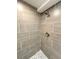 Walk-in shower with a rainfall shower head and gray tiled walls at 2090 S Clinton St, Denver, CO 80231