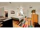 Attic bedroom with hard wood floors, natural light from sky lights, and a closet with built in clothing storage at 2351 Federal Blvd # 401, Denver, CO 80211