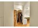 Walk in closet for main bedroom with shelving, closet rods, and storage at 2351 Federal Blvd # 401, Denver, CO 80211