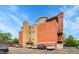 Brick apartment building featuring balconies and parking at 2351 Federal Blvd # 401, Denver, CO 80211