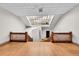 Bright hallway featuring natural light from a skylight and decorative railing at 2351 Federal Blvd # 401, Denver, CO 80211