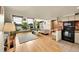 Bright living room featuring hardwood floors, large windows, and modern decor at 2351 Federal Blvd # 401, Denver, CO 80211