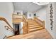 Grand staircase with wooden banisters and steps leading to upper and lower levels at 2351 Federal Blvd # 401, Denver, CO 80211