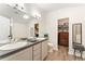 Dual-sink bathroom vanity with walk-in closet and vanity space at 10760 Eliot Cir # 204, Denver, CO 80234