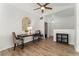 Dining area featuring hardwood floors, a modern table with chairs, and a stylish cabinet at 10760 Eliot Cir # 204, Denver, CO 80234