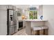 Modern kitchen featuring stainless steel appliances, ample counter space, and breakfast bar seating at 10760 Eliot Cir # 204, Denver, CO 80234