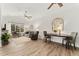 Bright living room featuring a fireplace, hardwood floors, vaulted ceilings and a dining area at 10760 Eliot Cir # 204, Denver, CO 80234