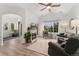 Bright living room featuring a fireplace, large window, and vaulted ceilings at 10760 Eliot Cir # 204, Denver, CO 80234