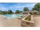Resort-style swimming pool and clubhouse nestled amid lush green trees at 10760 Eliot Cir # 204, Denver, CO 80234