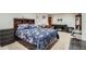 Cozy bedroom featuring a large bed, dresser, and tv, creating a comfortable retreat at 4849 S Pitkin Way, Aurora, CO 80015