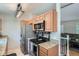Functional kitchen layout with stainless steel appliances, granite countertops, and ample cabinetry at 4849 S Pitkin Way, Aurora, CO 80015