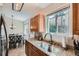 Well-equipped kitchen with granite countertops and a sink below the window at 4849 S Pitkin Way, Aurora, CO 80015