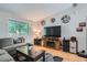 Comfortable living room with a large window, plush seating, and stylish decor at 4849 S Pitkin Way, Aurora, CO 80015