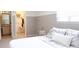 Bedroom featuring carpeted floors, half-painted walls and a closet area with a hanging rack at 849 Canary Ln, Brighton, CO 80601