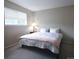 Simple bedroom with large window and comfortable bedding at 849 Canary Ln, Brighton, CO 80601