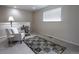 Relaxing bedroom space with a cozy chair and patterned rug at 849 Canary Ln, Brighton, CO 80601