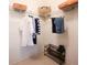Organized closet with hanging clothes, shelving and a shoe rack at 849 Canary Ln, Brighton, CO 80601