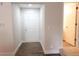 Bright entryway featuring hardwood floors, a white door, and neutral walls at 849 Canary Ln, Brighton, CO 80601