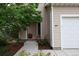 Close-up of the home's exterior, highlighting the front entrance and landscaping at 849 Canary Ln, Brighton, CO 80601