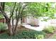 Charming front yard with mature trees, landscaping, and a welcoming entrance at 849 Canary Ln, Brighton, CO 80601