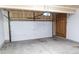 Clean, empty garage with automatic door, ready for parking or storage at 849 Canary Ln, Brighton, CO 80601