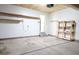 Spacious garage with ample storage, shelving, and well-lit for all your needs at 849 Canary Ln, Brighton, CO 80601