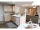 Cozy kitchen area with breakfast table looking into the living room at 849 Canary Ln, Brighton, CO 80601