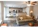 Bright living room featuring hardwood floors, comfortable seating, and natural light at 849 Canary Ln, Brighton, CO 80601