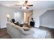 Comfortable living room with ceiling fan and staircase access at 849 Canary Ln, Brighton, CO 80601