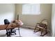 Bright home office featuring a desk, chair, and natural light from the window at 849 Canary Ln, Brighton, CO 80601