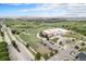 Aerial view of the building with an airport in the background and a parking lot with cars at 2908 N Florence St, Denver, CO 80238