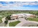 Aerial view of the building with solar panels on the roof and a parking lot with cars at 2908 N Florence St, Denver, CO 80238