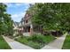 Charming two-story home featuring a welcoming front porch and a beautifully landscaped yard at 2908 N Florence St, Denver, CO 80238