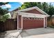 Attached two-car garage with automatic door, offering convenient parking and storage space at 2908 N Florence St, Denver, CO 80238