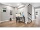 Bright home office space with modern desk, gray chair, and stylish decor near the staircase at 2908 N Florence St, Denver, CO 80238