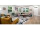 Bright and airy living room featuring stylish decor, hardwood floors, and large windows at 2908 N Florence St, Denver, CO 80238