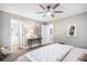 Spacious main bedroom with neutral tones, ceiling fan and ensuite bathroom access at 2908 N Florence St, Denver, CO 80238
