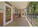 Large, tiled balcony with brick accents and ample space for seating, accessible through a glass door at 1521 Vine St # 101, Denver, CO 80206