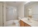 Well-lit bathroom with a tub-shower combo and a sink with modern fixtures at 1521 Vine St # 101, Denver, CO 80206