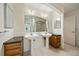 Modern bathroom with double sinks, large mirrors, and ample counter space at 1521 Vine St # 101, Denver, CO 80206