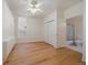 Cozy bedroom featuring hardwood floors, closet, and an attached bathroom at 1521 Vine St # 101, Denver, CO 80206