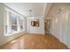 Sunlit living room with hardwood floors and a pass through to the kitchen at 1521 Vine St # 101, Denver, CO 80206