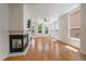 Spacious living room with hardwood floors, a fireplace, and lots of windows at 1521 Vine St # 101, Denver, CO 80206