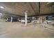 Well-lit parking garage with clearly marked spaces and assigned storage areas for residents at 1521 Vine St # 101, Denver, CO 80206