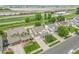 Lovely aerial view showcasing homes near a lake and railway, surrounded by greenery at 11285 Iola St, Commerce City, CO 80640