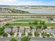 Stunning aerial view of neighborhood homes near a scenic lake and railway at 11285 Iola St, Commerce City, CO 80640