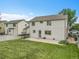 Spacious, well-maintained backyard featuring a lush lawn and a patio area for outdoor enjoyment at 11285 Iola St, Commerce City, CO 80640