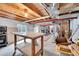Unfinished basement with exposed wood beams and utilitarian features at 11285 Iola St, Commerce City, CO 80640