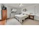 Bright bedroom with a comfortable bed, window with blinds, and a television, creating a relaxing retreat at 11285 Iola St, Commerce City, CO 80640